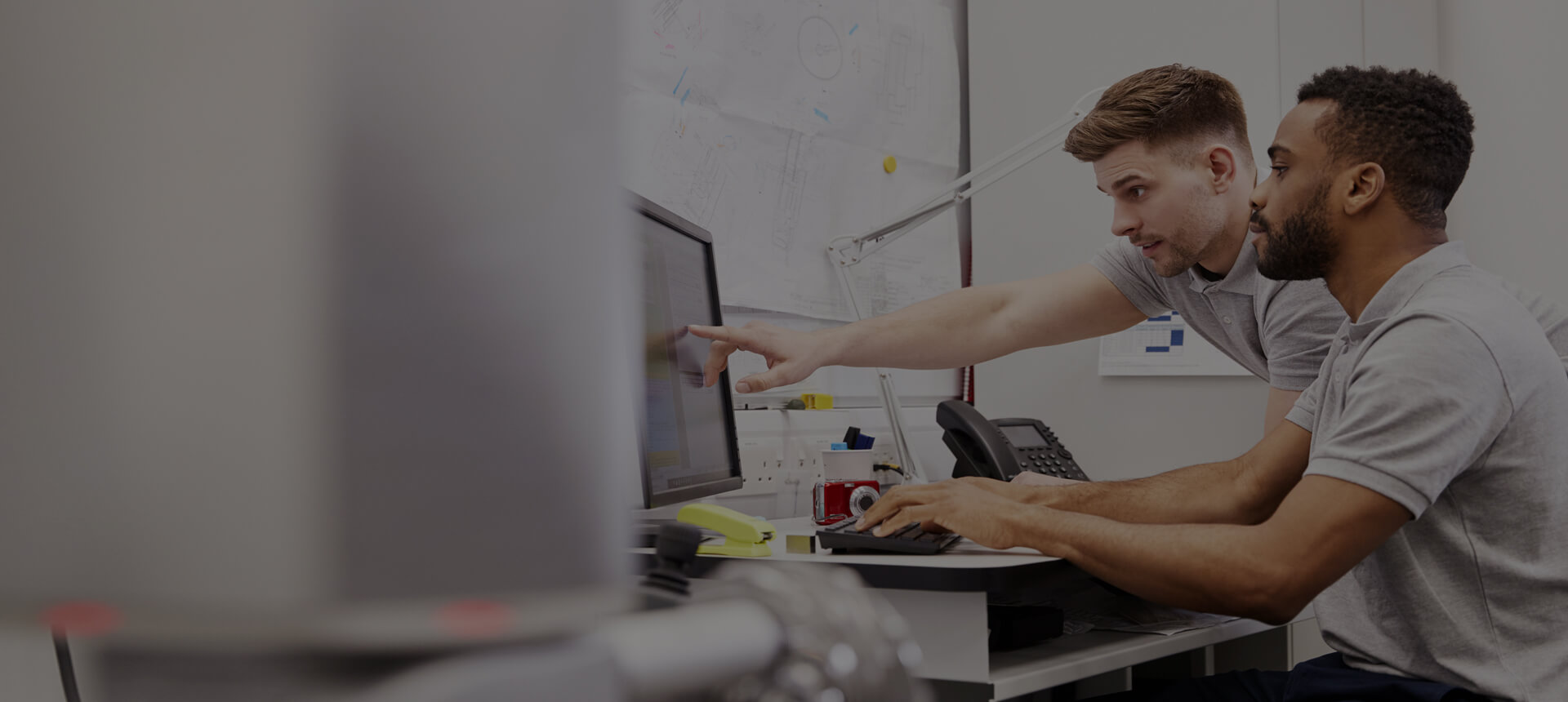 Computer tech helping user